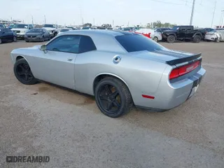 2012 Dodge Challenger SXT Plus with VIN 2C3CDYAG9CH104972, listed as a IAAI auction lot 41738042 with 148,794 mi miles. Bid and sale history available at carsss.com. Image 3.