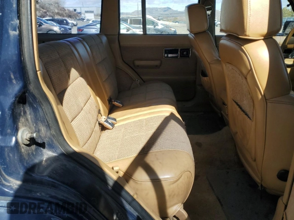 1987 Jeep Cherokee with VIN 1JCMT7842HT114597, listed as a Copart auction lot 49319945 with 230,675 mi miles and Clean title. Bid and sale history available at DreamBid. Image 10.