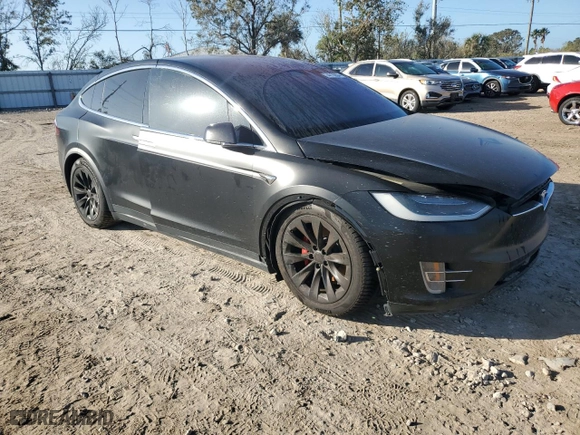 2017 Tesla Model X P100D with VIN 5YJXCBE4XHF040743, listed as a Copart auction lot 74010904 with NaN miles and Salvage Title. Bid and sale history available at carsss.com. Image 4.