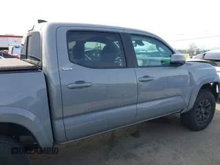 2020 Toyota Tacoma SR5 with VIN 5TFAZ5CN6LX089275, listed as a IAAI auction lot 41987526 with 51,661 mi miles and . Bid and sale history available at DreamBid. Image 14.