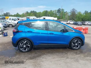 2023 Chevrolet Bolt EV 2LT z VIN 1G1FX6S05P4128607, wystawiony jako IAAI lot #42081752 z przebiegiem 22 551 mil mil oraz . Historia ofert i sprzedaży dostępna na DreamBid. Obrazek 13.