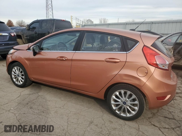 2017 Ford Fiesta Titanium with VIN 3FADP4FJ8HM164132, listed as a Copart auction lot 82577424 with 63,686 mi miles and Salvage Title. Bid and sale history available at DreamBid. Image 2.