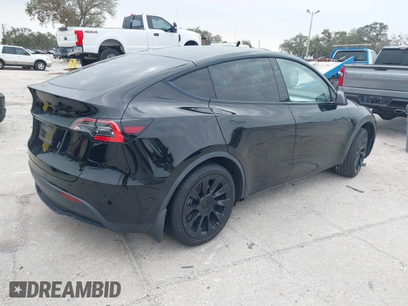 2021 Tesla Model Y Standard Range with VIN 5YJYGDED8MF123246, listed as a IAAI auction lot 41291676 with 74,630 mi miles and . Bid and sale history available at DreamBid. Image 4.