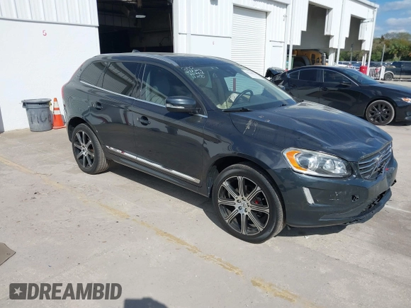2015 Volvo XC60 T5 Drive-E Premier Plus with VIN YV440MDC7F2606774, listed as a IAAI auction lot 41564034 with 166,758 mi miles. Bid and sale history available at carsss.com. Image 1.