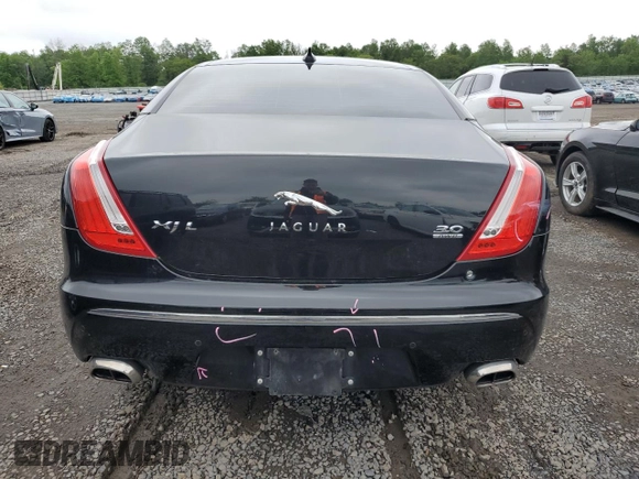 2013 Jaguar XJ Portfolio with VIN SAJWJ2GD0D8V44292, listed as a Copart auction lot 57073775 with 100,458 mi miles and Salvage Title. Bid and sale history available at DreamBid. Image 6.
