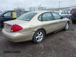 2001 Ford Taurus SES with VIN 1FAFP55S01A155758, listed as a IAAI auction lot 42152091 with 74,817 mi miles. Bid and sale history available at carsss.com. Image 4.