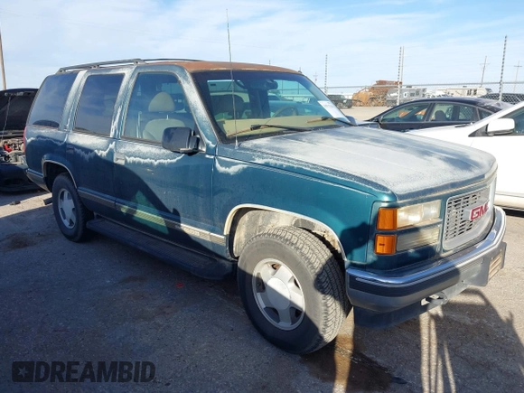 1997 GMC Yukon with VIN 1GKEK13R1VJ723409, listed as a IAAI auction lot 41512184 with 235,988 mi miles. Bid and sale history available at carsss.com. Image 1.