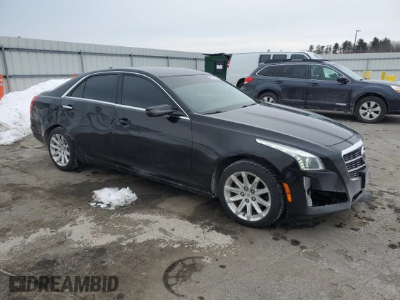 2014 Cadillac CTS AWD with VIN 1G6AW5SX6E0142793, listed as a Copart auction lot 43312545 with 101,124 mi miles and Salvage title. Bid and sale history available at DreamBid. Image 4.
