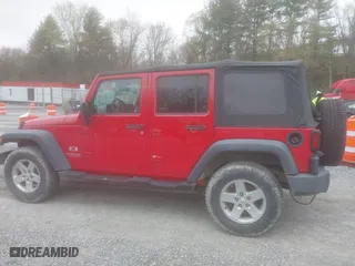 2008 Jeep Wrangler Unlimited X with VIN 1J8GA39128L562347, listed as a IAAI auction lot 41912669 with 106,040 mi miles. Bid and sale history available at carsss.com. Image 15.