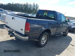 2001 Ford F-150 XL with VIN 1FTRX18L11NA30541, listed as a IAAI auction lot 42143117 with 187,855 mi miles. Bid and sale history available at carsss.com. Image 4.