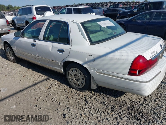 2004 Mercury Grand Marquis GS z VIN 2MEFM74W74X654151, wystawiony jako IAAI lot #42185493 z przebiegiem 203 017 mil mil oraz . Historia ofert i sprzedaży dostępna na DreamBid. Obrazek 3.