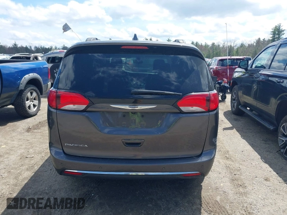 2017 Chrysler Pacifica Touring L with VIN 2C4RC1BGXHR667397, listed as a IAAI auction lot 42085117 with 63,996 mi miles and . Bid and sale history available at DreamBid. Image 16.