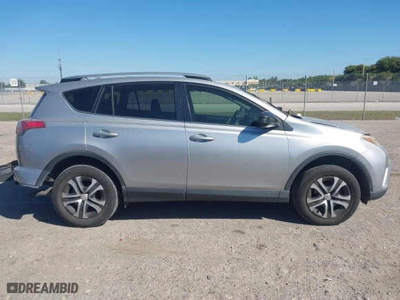 2018 Toyota RAV4 LE with VIN JTMZFREVXJJ196183, listed as a IAAI auction lot 41776107 with 82,713 mi miles. Bid and sale history available at carsss.com. Image 14.