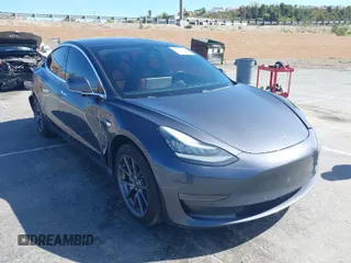 2019 Tesla Model 3 Mid Range with VIN 5YJ3E1EA6KF307456, listed as a IAAI auction lot 41944454 with 99,059 mi miles. Bid and sale history available at carsss.com. Image 1.