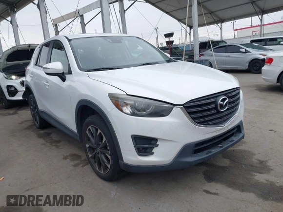 2016 Mazda CX-5 Grand Touring with VIN JM3KE4DY7G0737232, listed as a IAAI auction lot 42158279 with Not Provided miles and . Bid and sale history available at DreamBid. Image 1.