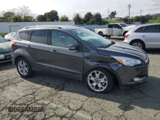 2015 Ford Escape Titanium with VIN 1FMCU0J98FUA46879, listed as a Copart auction lot 51173555 with 72,093 mi miles and Salvage Title. Bid and sale history available at DreamBid. Image 4.