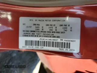 1998 Mazda Protege DX z VIN JM1BC1411W0198007, wystawiony jako Copart lot #46941185 z przebiegiem 101 696 mil mil oraz Szkoda całkowita • Salvage title. Historia ofert i sprzedaży dostępna na DreamBid. Obrazek 13.