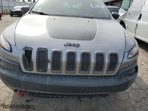 2015 Jeep Cherokee Trailhawk with VIN 1C4PJMBSXFW672073, listed as a Copart auction lot 71289874 with 999,999 mi miles and Clean Title. Bid and sale history available at carsss.com. Image 12.