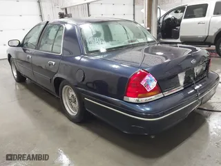 2000 Ford Crown Victoria with VIN 2FAFP73W1YX129365, listed as a IAAI auction lot 41865917 with 102,957 mi miles. Bid and sale history available at carsss.com. Image 3.