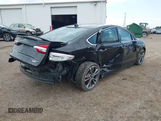 2020 Ford Fusion Titanium with VIN 3FA6P0D9XLR174523, listed as a IAAI auction lot 42100113 with 100,602 mi miles and . Bid and sale history available at DreamBid. Image 4.