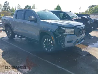 2023 Nissan Frontier Pro-4X z VIN 1N6ED1EK7PN603435, wystawiony jako IAAI lot #41963304 z przebiegiem 30 065 mil mil oraz . Historia ofert i sprzedaży dostępna na DreamBid. Obrazek 1.