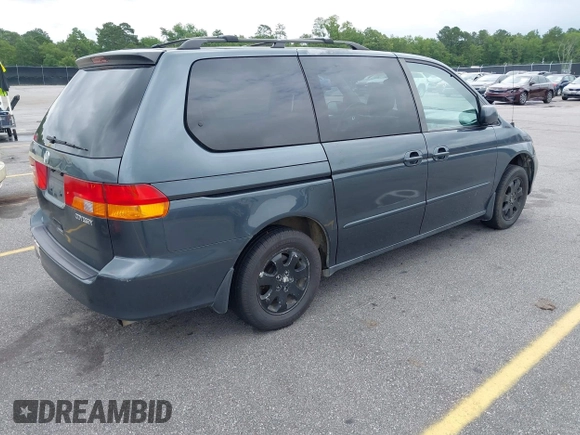 2003 Honda Odyssey EX-L with VIN 5FNRL18963B059910, listed as a IAAI auction lot 42415037 with 267,600 mi miles and . Bid and sale history available at DreamBid. Image 4.