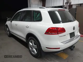 2012 Volkswagen Touareg Sport with VIN WVGFK9BP2CD002991, listed as a IAAI auction lot 42077523 with 94,515 mi miles and . Bid and sale history available at DreamBid. Image 3.