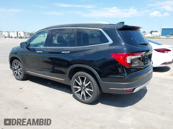 2019 Honda Pilot Touring 7-Passenger with VIN 5FNYF6H67KB031988, listed as a IAAI auction lot 42519588 with 41,368 mi miles and . Bid and sale history available at DreamBid. Image 3.