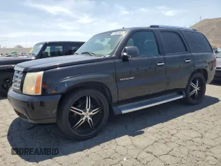 2002 Cadillac Escalade z VIN 1GYEC63T42R189976, wystawiony jako Copart lot #57852565 z przebiegiem 243 089 mil mil oraz Szkody całkowita. Historia ofert i sprzedaży dostępna na DreamBid. Obrazek 1.