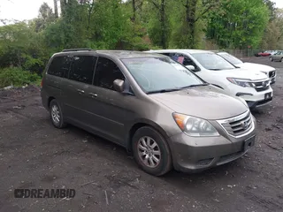 2009 Honda Odyssey EX-L with VIN 5FNRL38759B022866, listed as a IAAI auction lot 42200965 with 145,641 mi miles and . Bid and sale history available at DreamBid. Image 1.