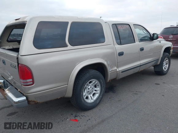 2002 Dodge Dakota SLT z VIN 1B7HG48N32S663205, wystawiony jako IAAI lot #41125874 z przebiegiem 186 761 mil mil oraz . Historia ofert i sprzedaży dostępna na DreamBid. Obrazek 4.