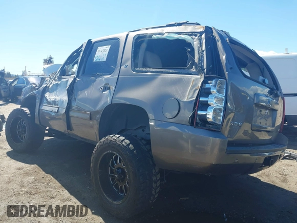 2012 Chevrolet Tahoe LT with VIN 1GNSKBE09CR100385, listed as a IAAI auction lot 41743325 with 185,174 mi miles and . Bid and sale history available at DreamBid. Image 3.