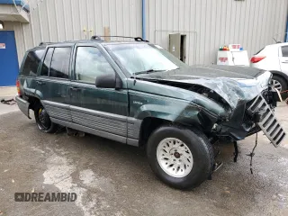 1995 Jeep Grand Cherokee Laredo with VIN 1J4FX58S8SC773884, listed as a Copart auction lot 56572555 with 424,126 mi miles and Salvage title. Bid and sale history available at DreamBid. Image 4.