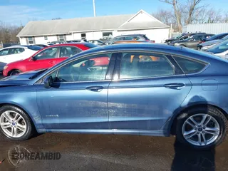 2018 Ford Fusion Hybrid SE with VIN 3FA6P0LU8JR229795, listed as a IAAI auction lot 41522818 with 115,420 mi miles. Bid and sale history available at carsss.com. Image 14.