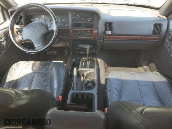 1998 Jeep Grand Cherokee Limited with VIN 1J4GZ78YXWC160346, listed as a Copart auction lot 52595655 with Not provided miles and Salvage title. Bid and sale history available at DreamBid. Image 8.