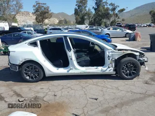 2018 Tesla Model 3 Long Range Battery with VIN 5YJ3E1EAXJF108781, listed as a IAAI auction lot 41962628 with 61,208 mi miles and . Bid and sale history available at DreamBid. Image 14.