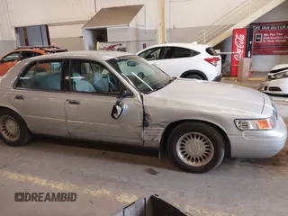 2000 Mercury Grand Marquis LS z VIN 2MEFM75W0YX736324, wystawiony jako IAAI lot #41865927 z przebiegiem 136 886 mil mil oraz . Historia ofert i sprzedaży dostępna na DreamBid. Obrazek 13.