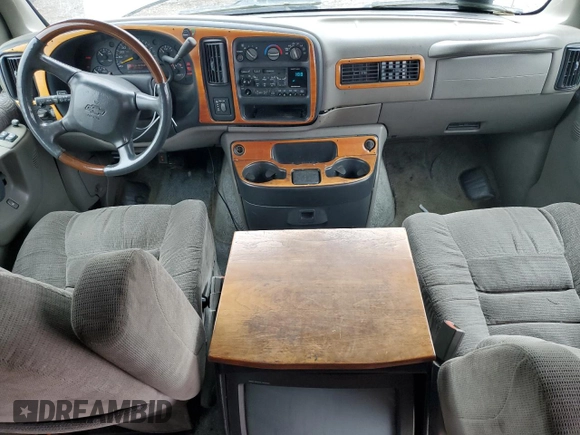 1999 Chevrolet Express z VIN 1GBFG15R9X1089305, wystawiony jako Copart lot #51810075 z przebiegiem 130 441 mil mil oraz Szkoda całkowita • Salvage title. Historia ofert i sprzedaży dostępna na DreamBid. Obrazek 8.