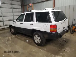 1995 Jeep Grand Cherokee Laredo with VIN 1J4GZ58S6SC630947, listed as a Copart auction lot 82143564 with 267,946 mi miles and Salvage Title. Bid and sale history available at carsss.com. Image 2.