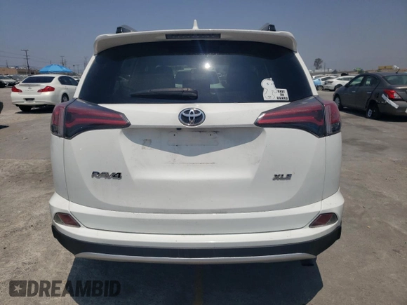 2018 Toyota RAV4 XLE with VIN JTMWFREVXJD118021, listed as a Copart auction lot 58845805 with 108,068 mi miles and Salvage title. Bid and sale history available at DreamBid. Image 6.