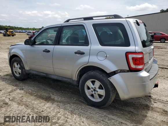 2010 Ford Escape XLS with VIN 1FMCU0C70AKB52226, listed as a Copart auction lot 58241455 with 237,785 mi miles and Salvage title. Bid and sale history available at DreamBid. Image 2.