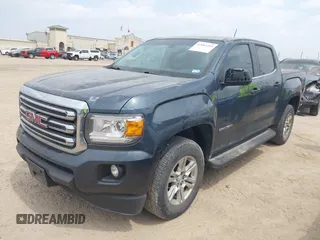 2019 GMC Canyon 4WD SLE z VIN 1GTG6CENXK1261278, wystawiony jako IAAI lot #42064295 z przebiegiem 51 786 mil mil oraz . Historia ofert i sprzedaży dostępna na DreamBid. Obrazek 2.