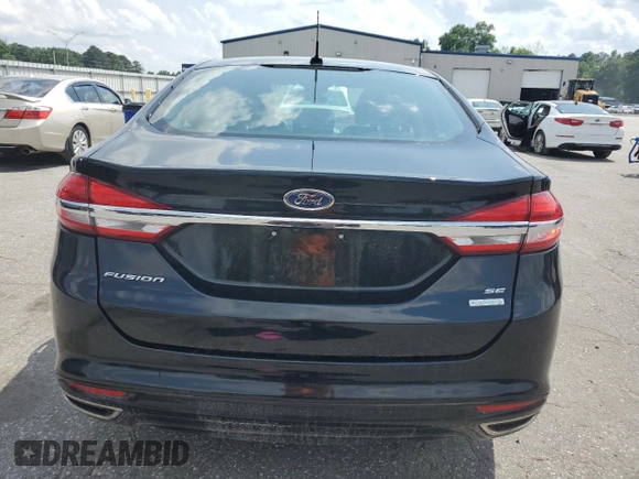 2017 Ford Fusion SE z VIN 3FA6P0H92HR150296, wystawiony jako Copart lot #57075385 z przebiegiem 135 304 mil mil oraz Szkoda całkowita • Salvage title. Historia ofert i sprzedaży dostępna na DreamBid. Obrazek 6.