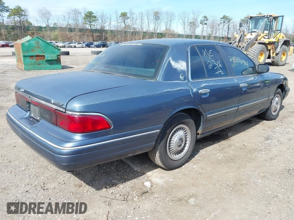 1996 Mercury Grand Marquis GS with VIN 2MELM74W8TX697141, listed as a IAAI auction lot 42082750 with 138,963 mi miles and . Bid and sale history available at DreamBid. Image 4.