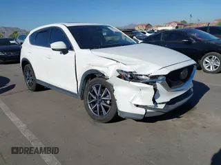 2018 Mazda CX-5 Grand Touring z VIN JM3KFADM7J0373815, wystawiony jako IAAI lot #42500311 z przebiegiem 106 354 mil mil oraz . Historia ofert i sprzedaży dostępna na DreamBid. Obrazek 1.