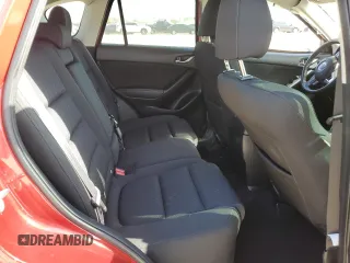 2016 Mazda CX-5 Touring with VIN JM3KE2CYXG0638247, listed as a Copart auction lot 53087305 with 0 mi miles and Salvage Title. Bid and sale history available at carsss.com. Image 10.