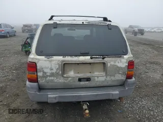 1997 Jeep Grand Cherokee Laredo with VIN 1J4GZ58Y5VC637350, listed as a Copart auction lot 77405444 with 182,482 mi miles and Clean Title. Bid and sale history available at carsss.com. Image 6.