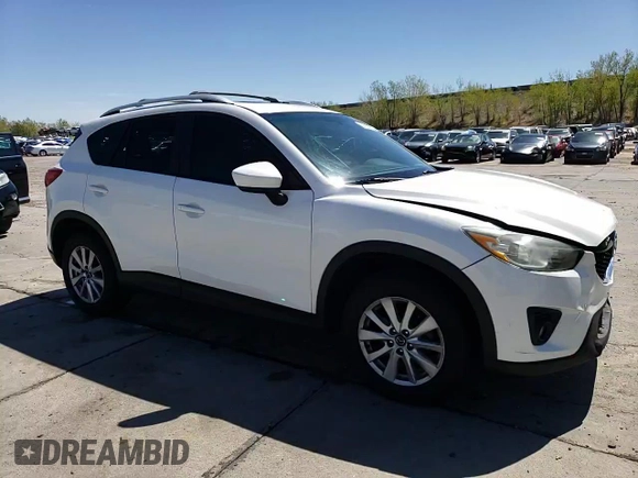 2014 Mazda CX-5 Touring z VIN JM3KE4CYXE0393443, wystawiony jako Copart lot #54738705 z przebiegiem 68 220 mil mil oraz Szkody całkowita. Historia ofert i sprzedaży dostępna na DreamBid. Obrazek 14.