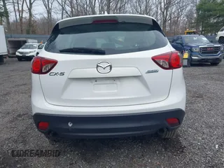 2014 Mazda CX-5 Sport with VIN JM3KE4BE3E0300849, listed as a IAAI auction lot 41942418 with 144,310 mi miles. Bid and sale history available at carsss.com. Image 16.