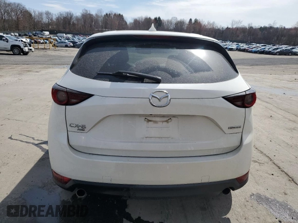 2021 Mazda CX-5 Touring z VIN JM3KFBCM9M1386068, wystawiony jako Copart lot #51735225 z przebiegiem 68 728 mil mil oraz Szkoda całkowita • Salvage title. Historia ofert i sprzedaży dostępna na DreamBid. Obrazek 6.